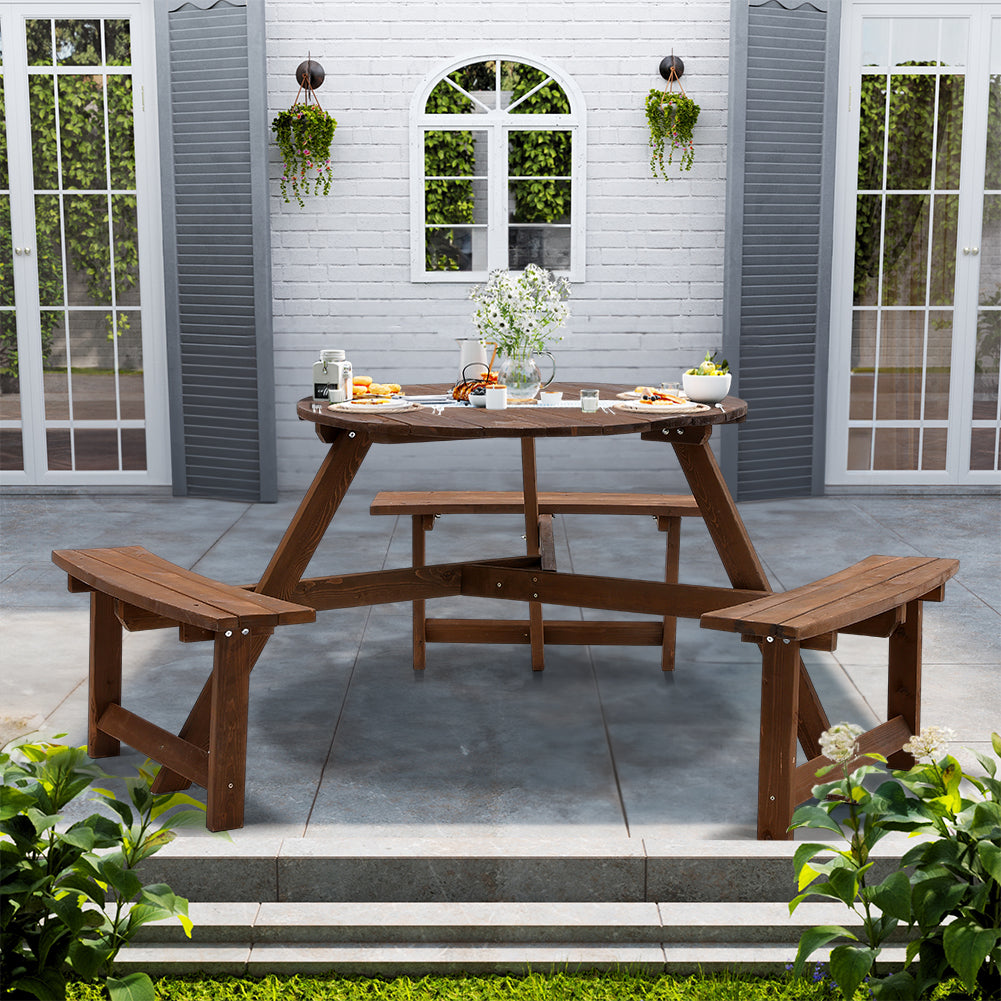 Round wooden picnic table deals with benches